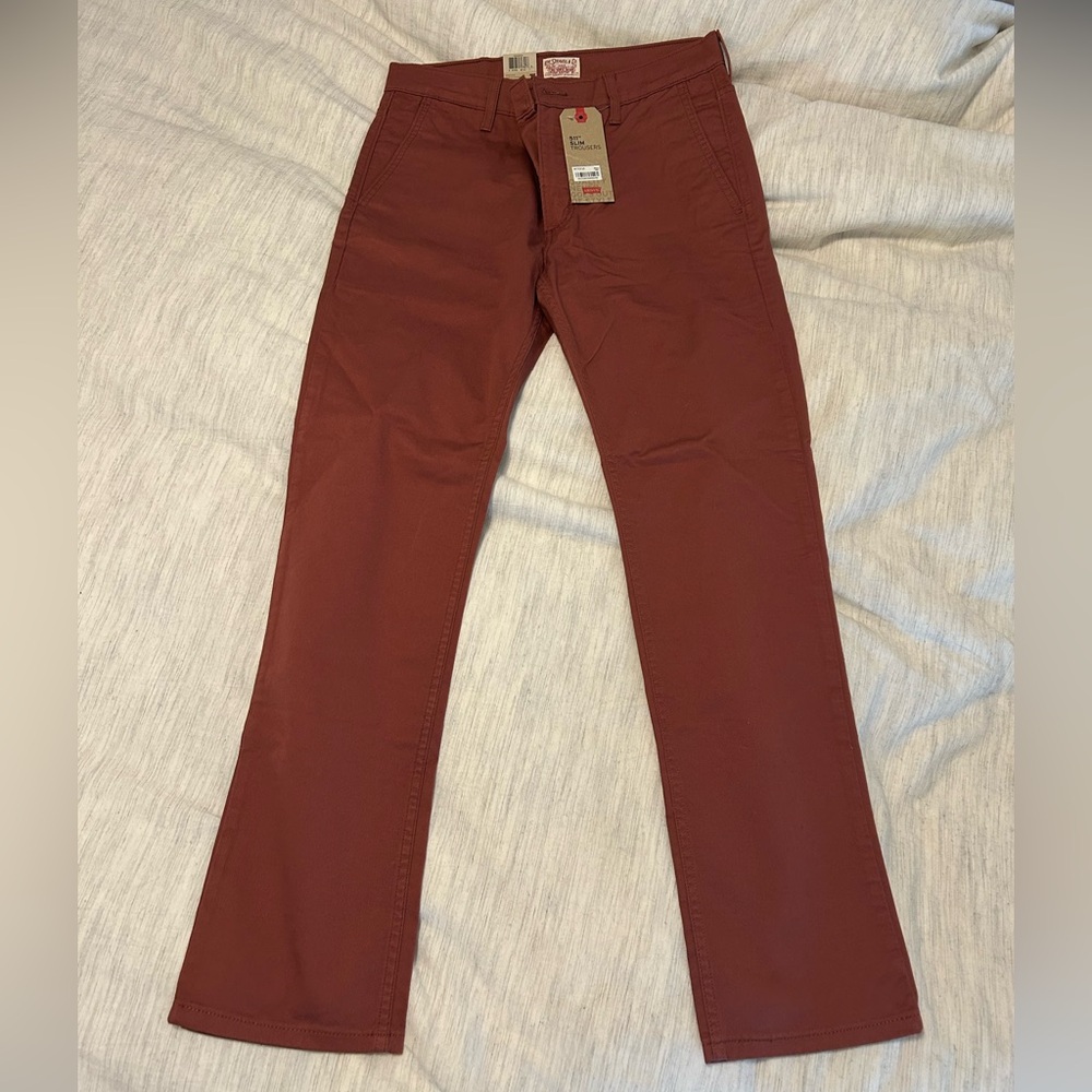 Men’s Levi’s 511 red trousers.